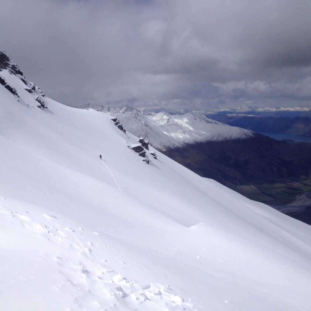 Skinning to the summit ridge of Treble Cone ski resort