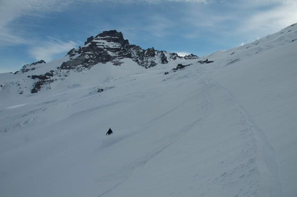 Snowboarding amazing snow on the Emmons Glacier with Little Tahoma behind