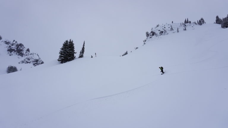 Snowboarding off the south side of Castle Peak towards Butler Creek