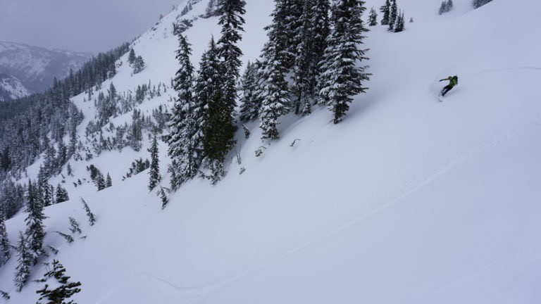 Riding into the south gully of Castle Peak in powder conditions