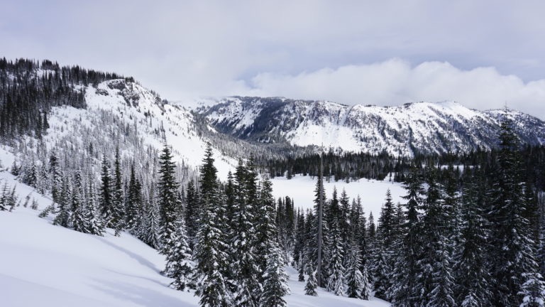 Looking back at Louise Lake as we skin up into the Tatoosh Range