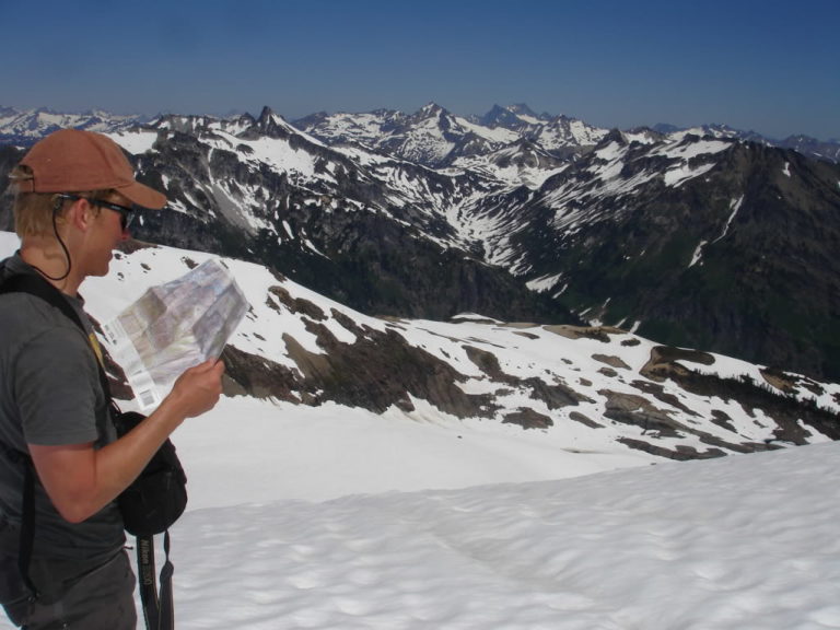 Studying the map while on the Dakobed Traverse