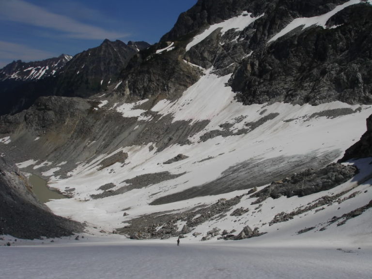 Skinning the Honeycomb Glacier with the moraine lake in the distance as we make our day towards Glacier Peak