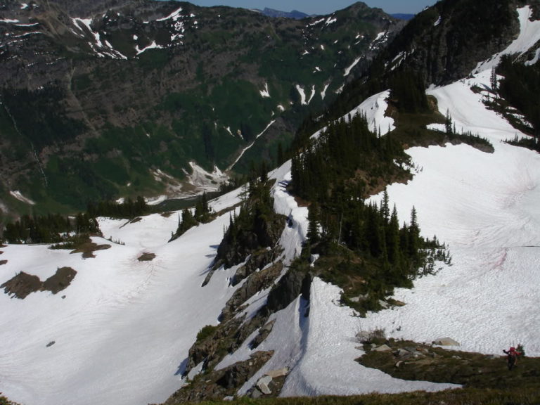 Jason Climbing up to Mount Clark and the Dakobed Traverse with Boulder pass below