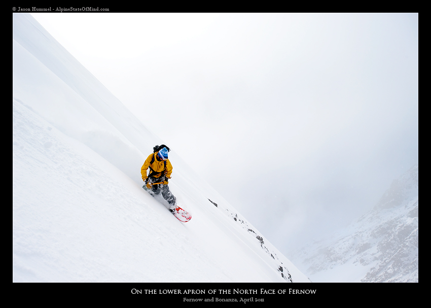 Snowboarding down the steep upper face of Mount Fernow near Holden Village in Washington State