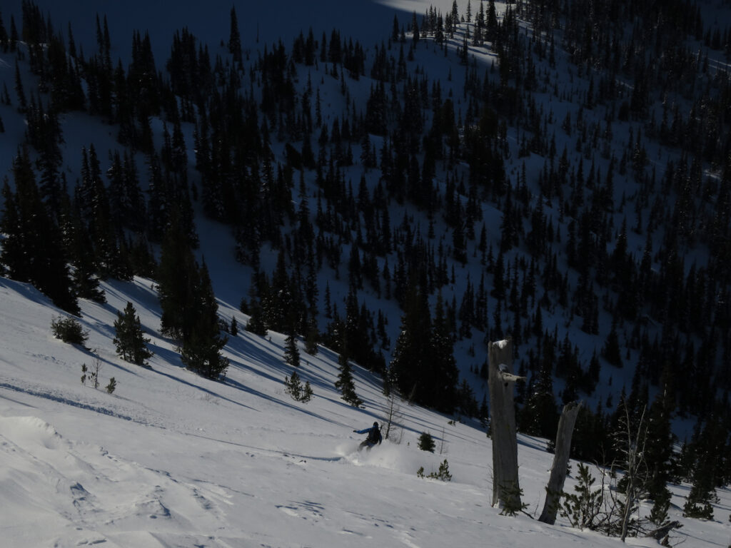 Snowboarding into Crystal Lakes basin before heading out to the Sheep Lake Couloir