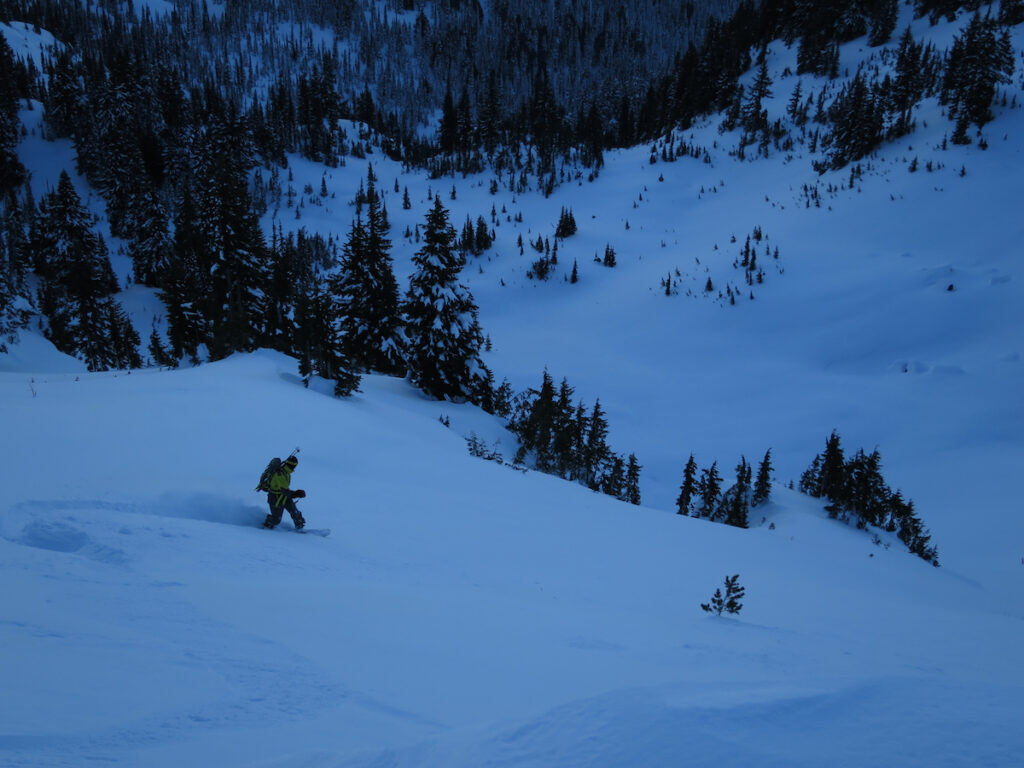 Snowboarding into Union Creek after riding the Sheep Lake Couloir in the Crystal Mountain Backcountry