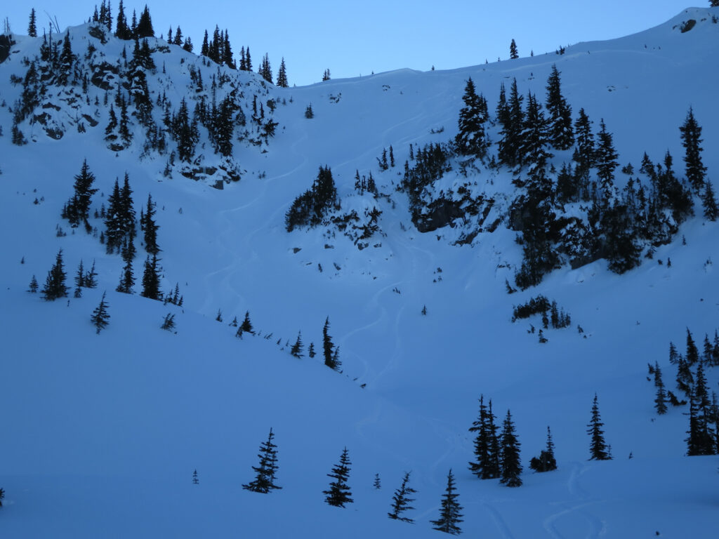 Looking back up at our tracks in Morse Creek Basin while ski touring the Crystal Mountain backcountry