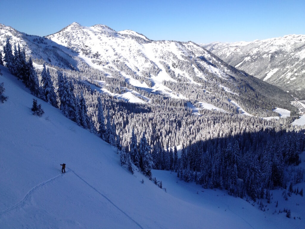 Ski touring the Crystal Mountain Silverbasin backcountry and heading towards Dogleg Peak