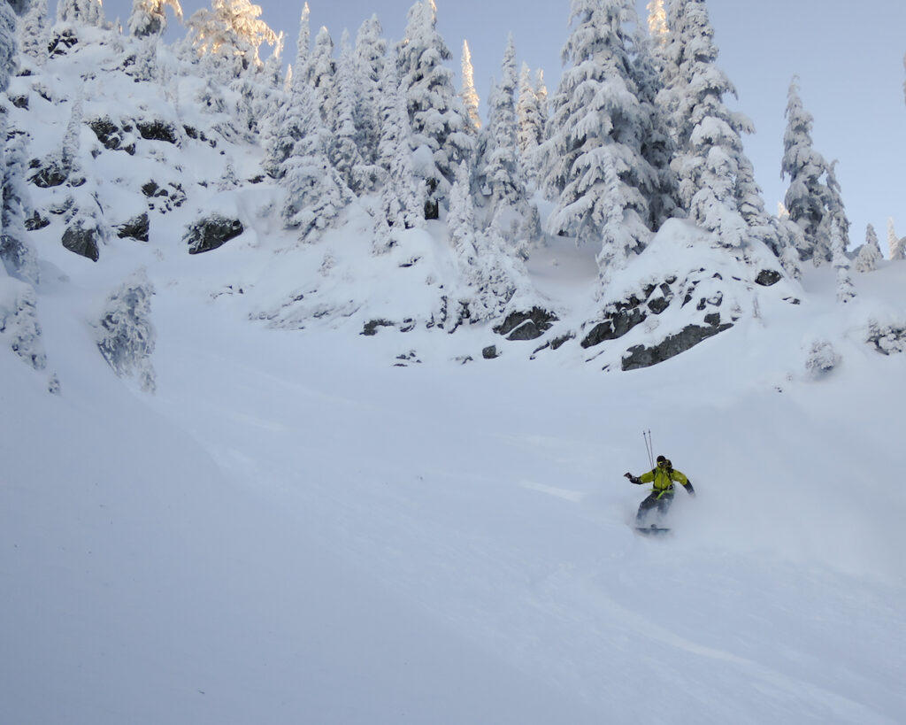 Enjoying amazing powder snow while riding down the Dog Leg Chute