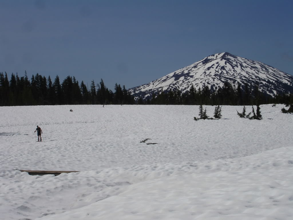 ski touring to Broken Top with Mount Bachelor in the distance.
