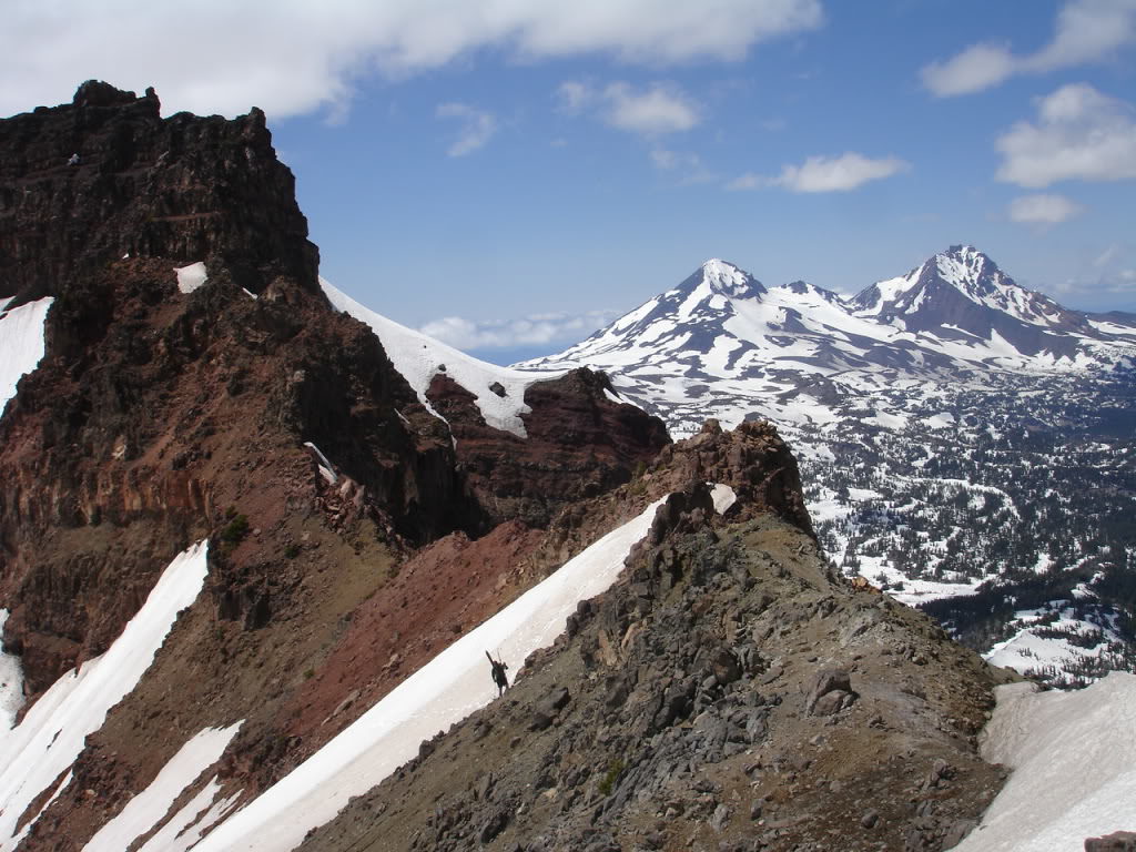 Climbing the ridge with the Middle and North Sisters in the distance