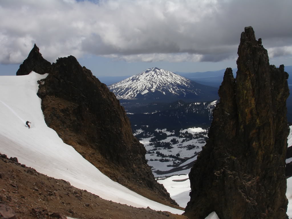 Snowboarding the East Rim of Broken Top with Mount Bachelor in the background