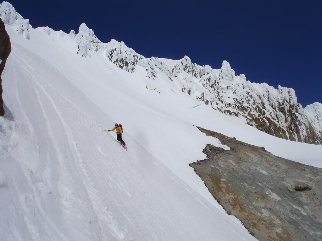 Snowboarding past the sulfur vents after descending the Old Chute on Mount Hood