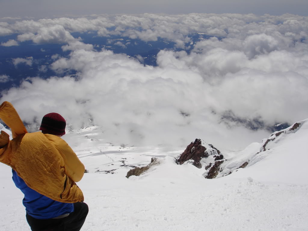Resting on the summit of Mount Hood with a clear view of the Palmer Glacier and Timberline ski resort