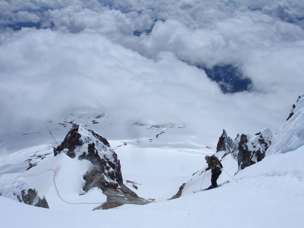 Preparing for a ski descent of Mount Hood while standing on top of the Old Chute