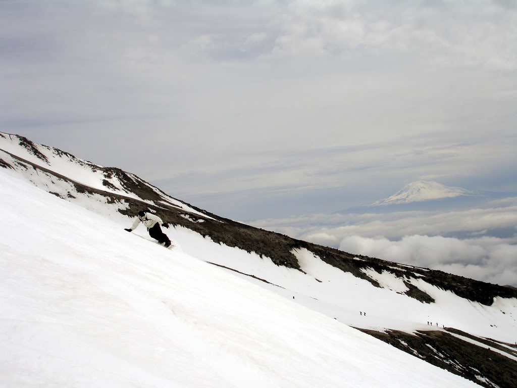 Snowboarding down the Worm Flow Route while people are climbing Mount Saint Helens