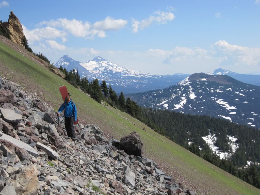 Walking on the dirt with North Sister in the distance