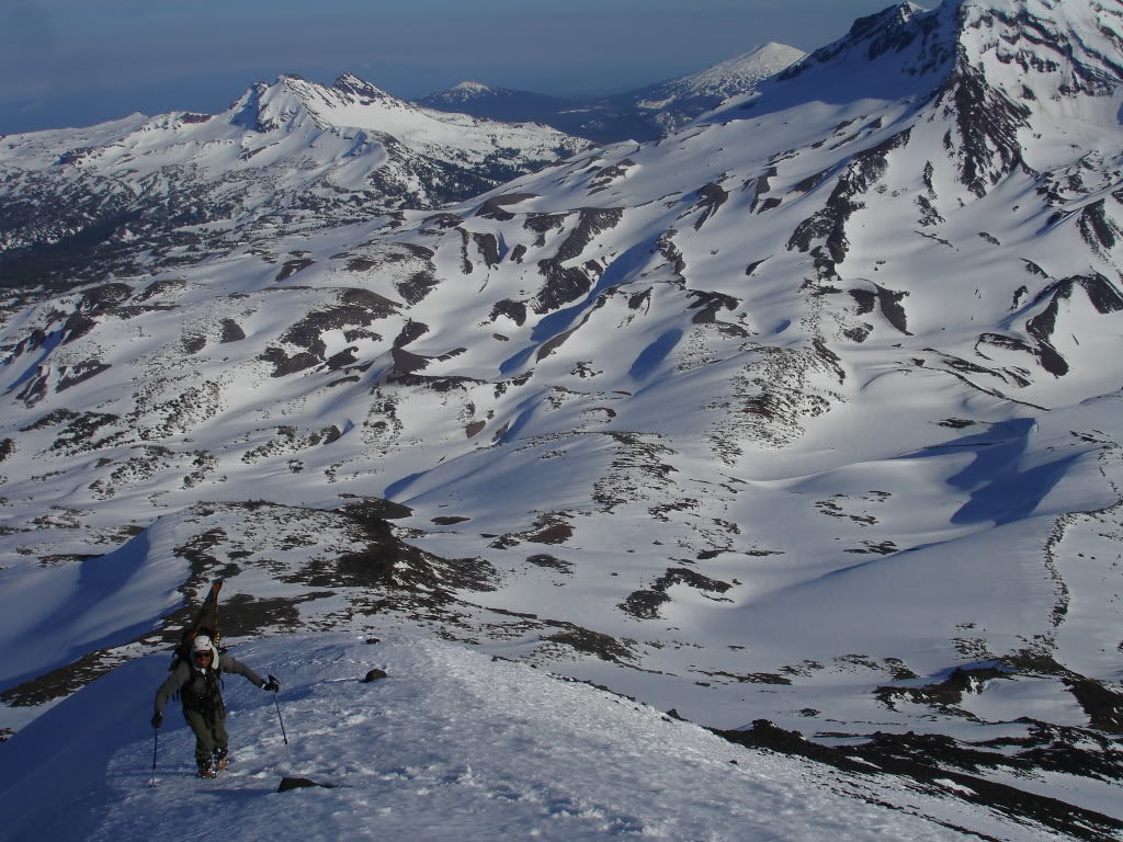 Climbing the south ridge of the Middle Sister with the South Sister in the distance in Three Sisters Wilderness