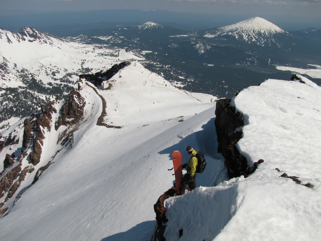 Preparing to snowboard down the Prouty Glacier Headwall while on the summit of the South Sister in Three Sisters Wilderness