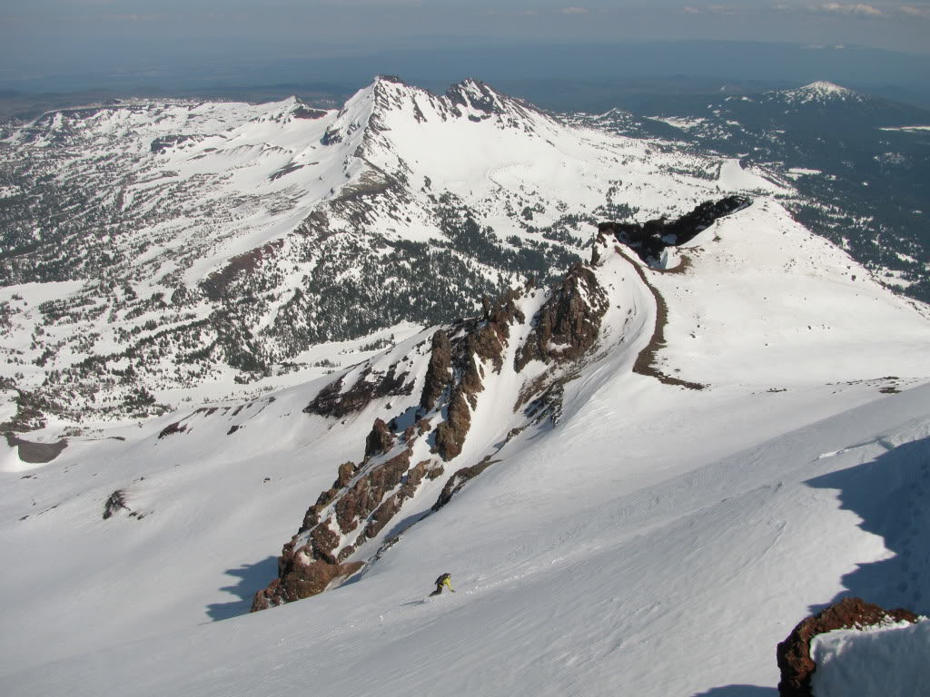 Snowboarding down the Prouty Glacier off the summit of the South Sister in Three Sisters Wilderness