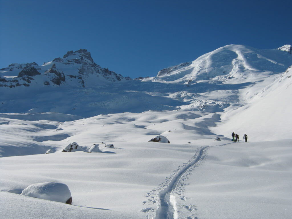 Ski touring up the Emmons Glacier in Winter while exploring the backcountry of Mount Rainier National Park
