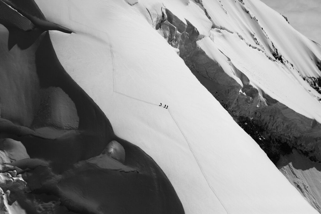 John Scurlock photo of people si touring up the North Ridge of Mount Baker