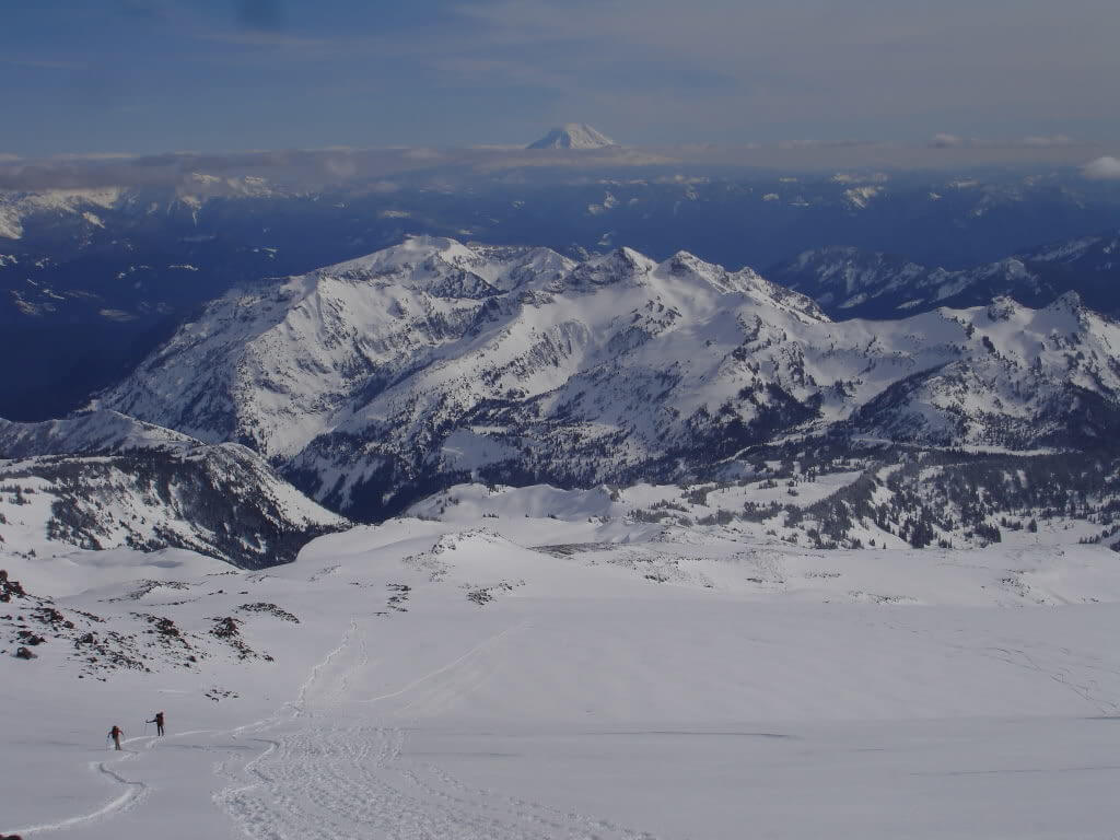 Ski touring in Mount Rainier National Park while heading up the Muir Snowfield near the Paradise Visitor Center