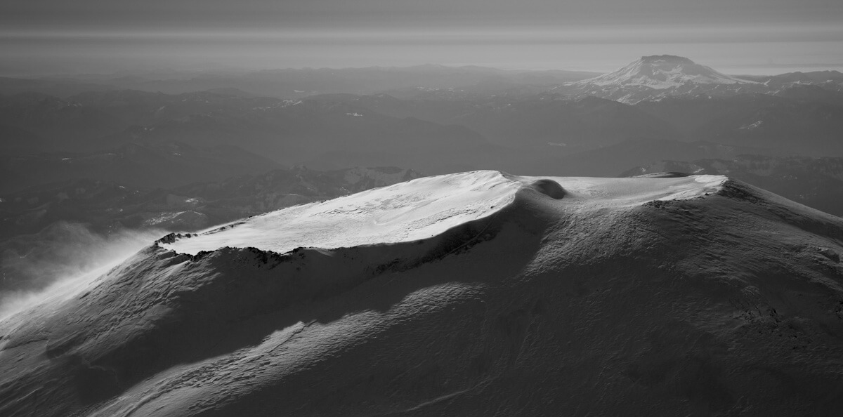 A scenic photo of the summit of Mount Rainier from John Scurlock