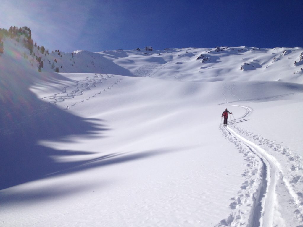 ski touring up a north facing slope