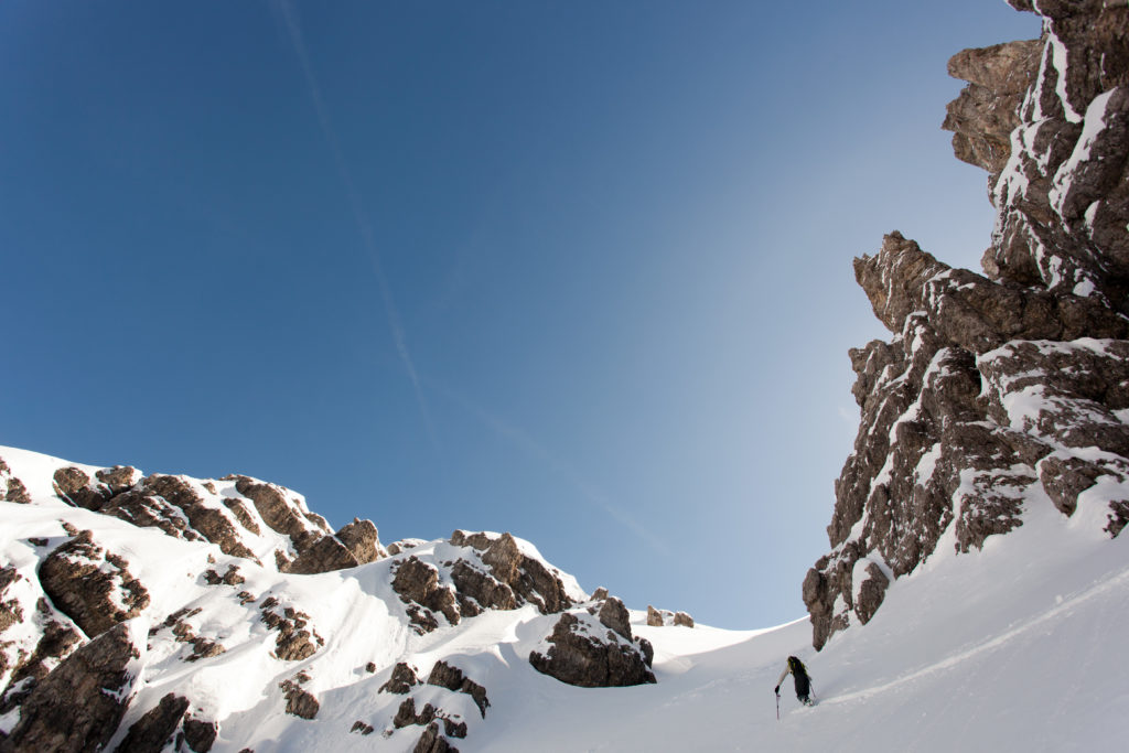 ski touring up the next bowl for a second lap