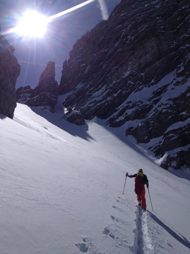 Ski touring up a tight couloir in the Austrian Alps