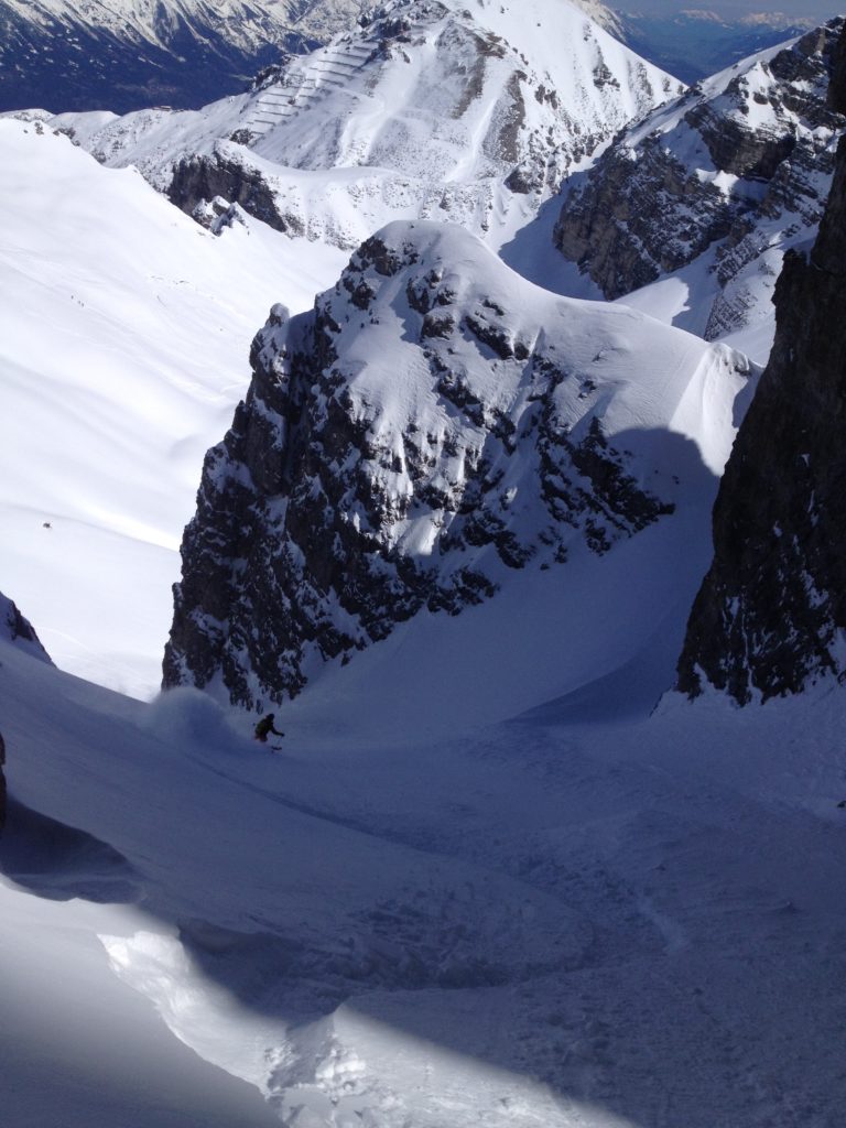 Finding deep snow while riding a sheltered couloir