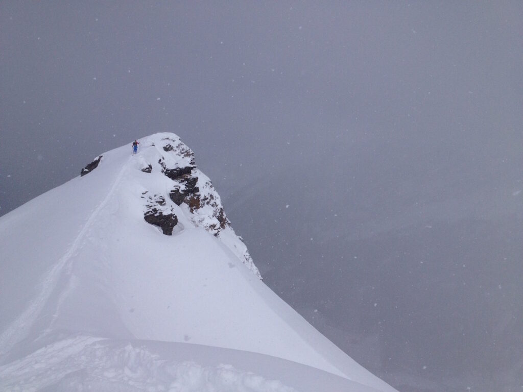 Climbing up to the top of Geierschnabel Valsertal in the backcountry of Austria