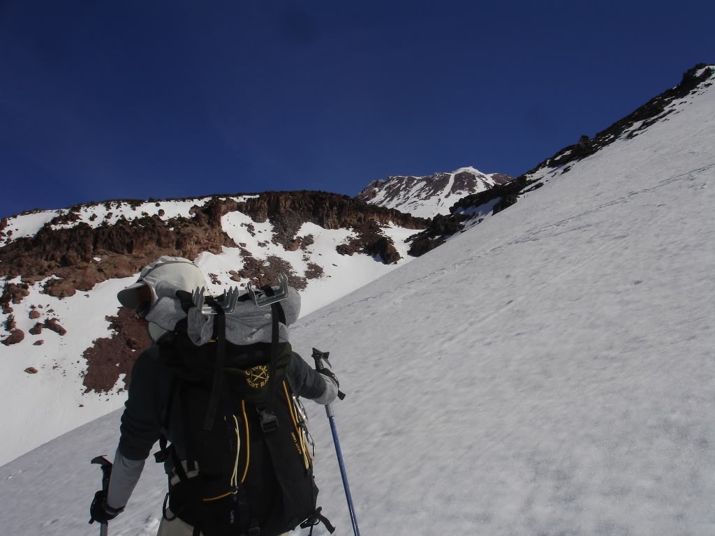 Amar skinning through a low saddle to access hidden valley with Shastina in the distance