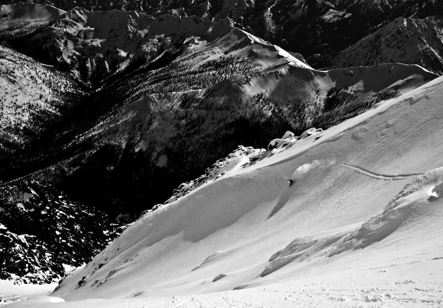 Snowboarding off the summit of Mount Stuart down Ulrich's Couloir