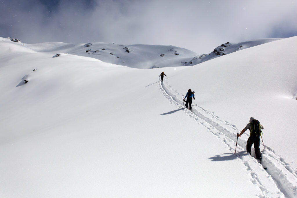 Breaking trail towards the second ski descent of the day