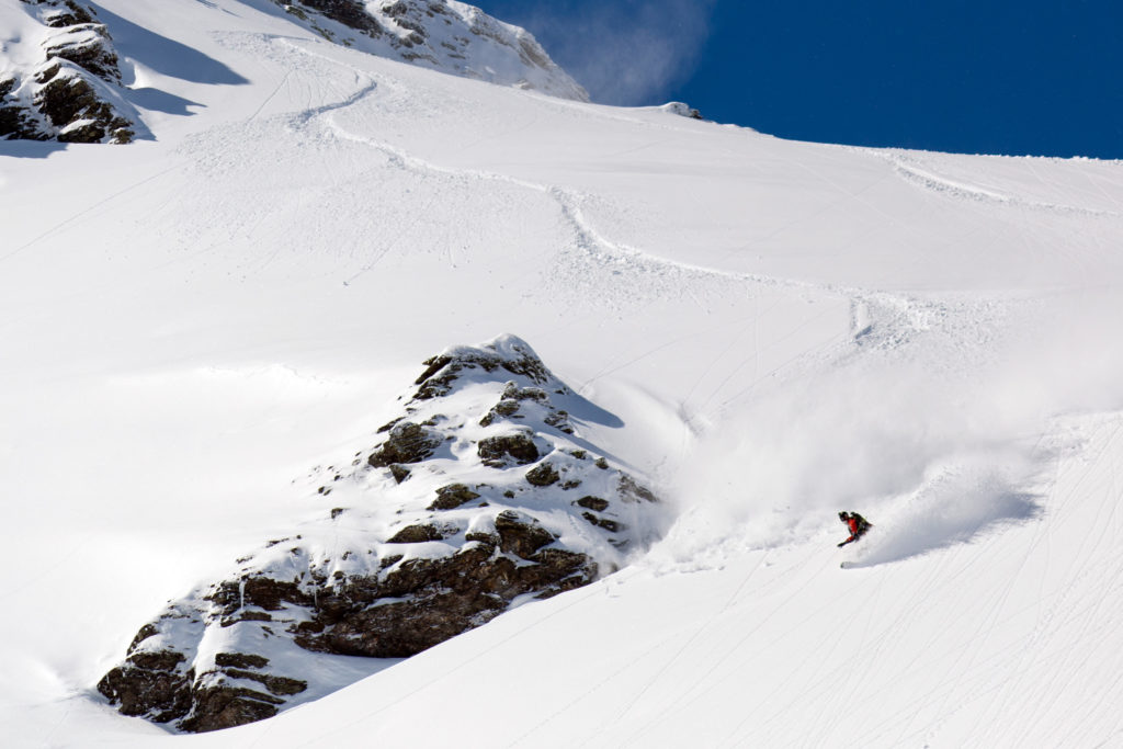 Laying down snowboard tracks in the Zillertal Backcountry while snowboarding in Austria