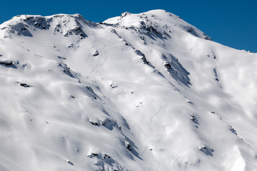 Looking back at our ski tracks in the Zillertal Backcountry while Snowboarding in Austria