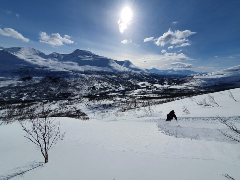 Snowboarding down the pipes on Blåbaerfjellet in the Tamokdalen Valley