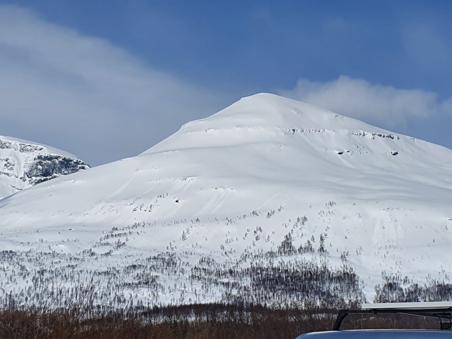 Looking at the South face of Sjufjellet from the Tamokdalen valley in Northern Norway