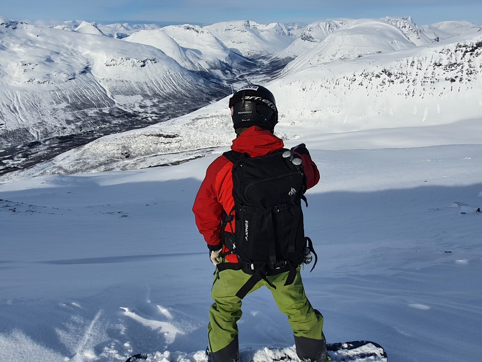 Preparing to Snowboard down Istinden Ridge