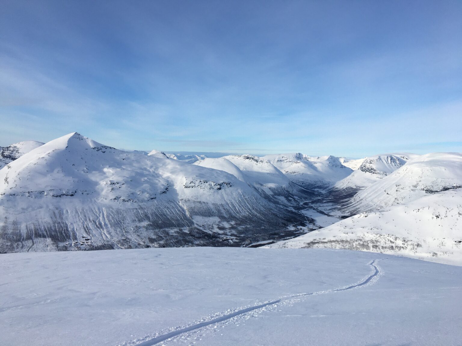 Looking at Blåbærfjellet while ski touring up Istinden