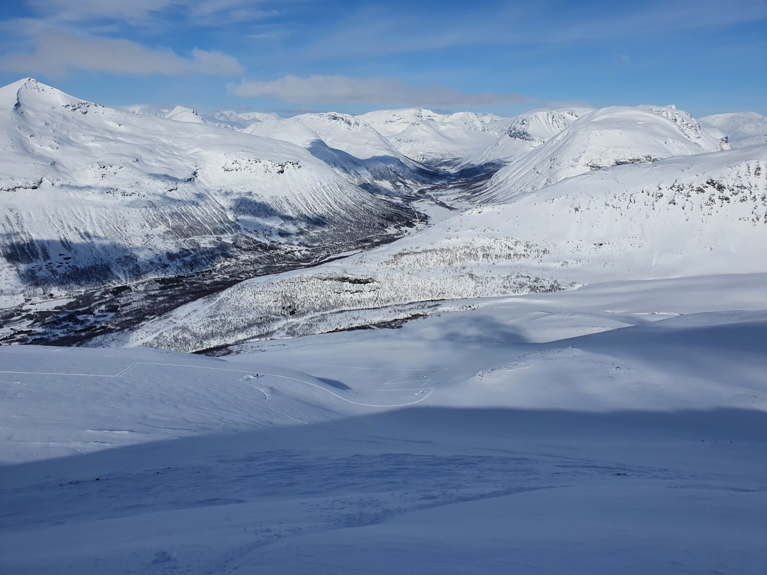 Making first turns down the Northeast bowl of Istinden