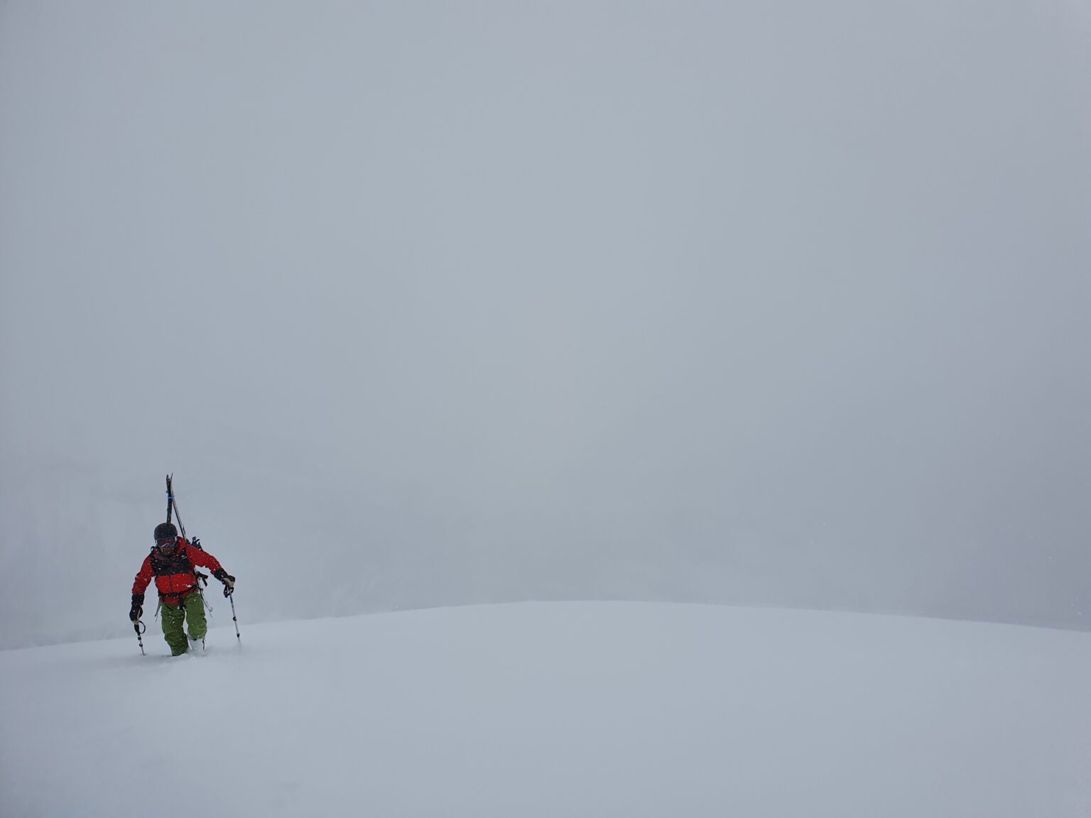 Climbing up the South face of Sjufjellet in the Tamokdalen Backcountry