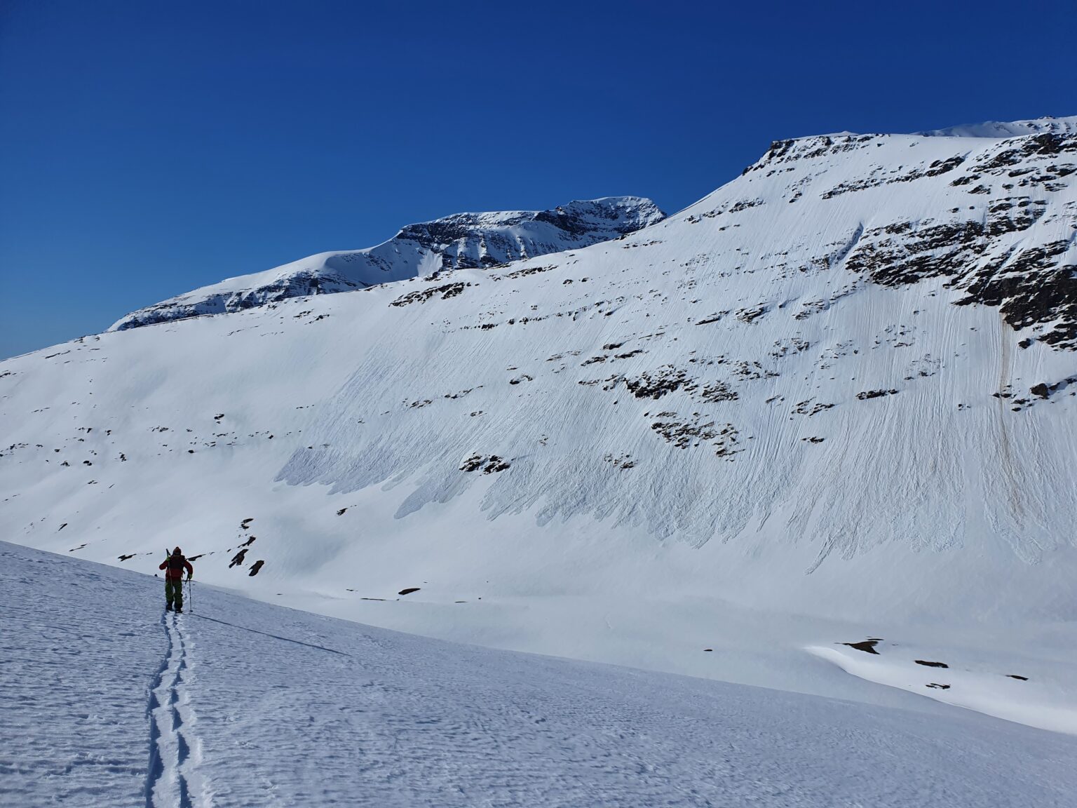 Doing a low angle ski traverse to gain access to the upper slopes