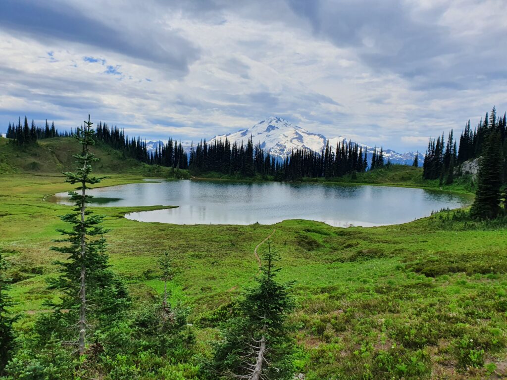 Looking at Glacier Peak from the shores of Image Lake