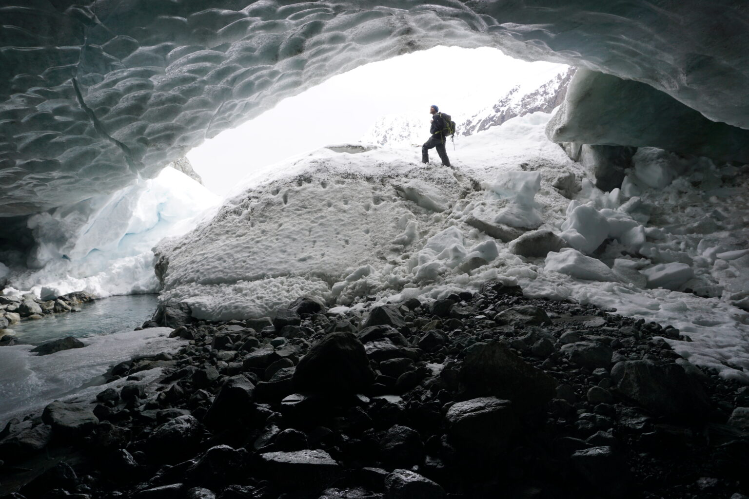 Hiking into the glacial cave of Strupbeen Glacier