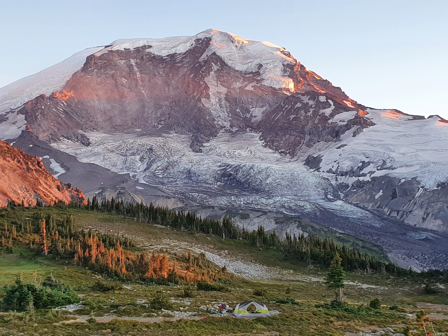 Enjoying one of the best camping spots in Mount Rainier National Park sleeping up in Moraine Park with the sunset alpenglow over the Willis Wall
