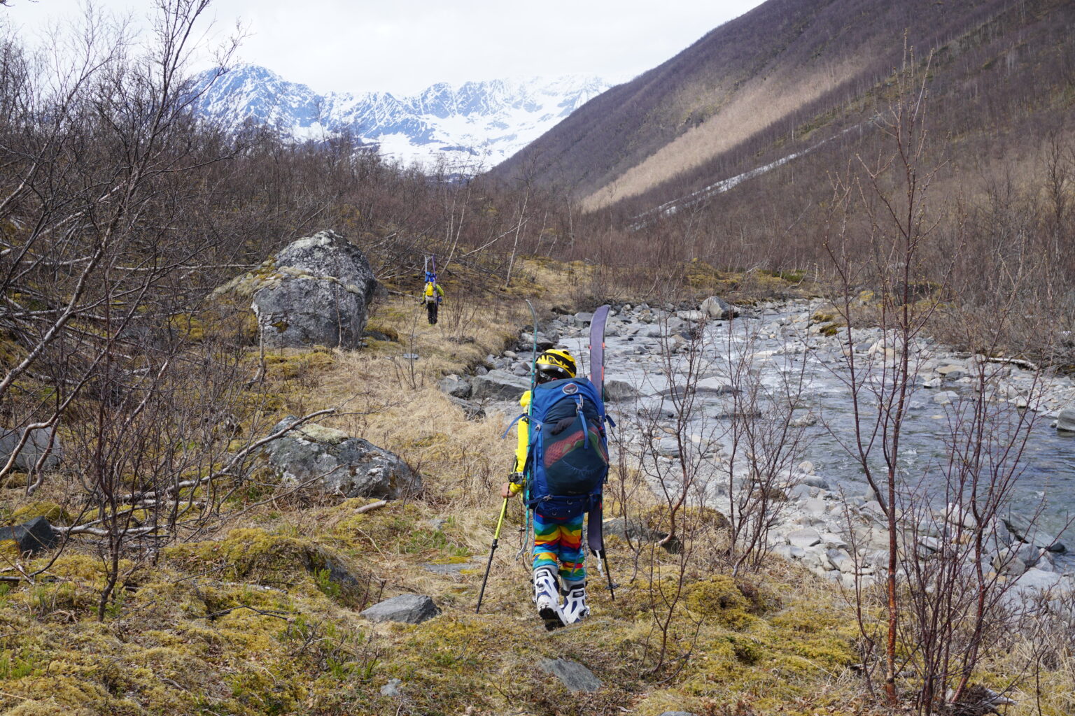 Elias hiking up the valley we skis as big as he is